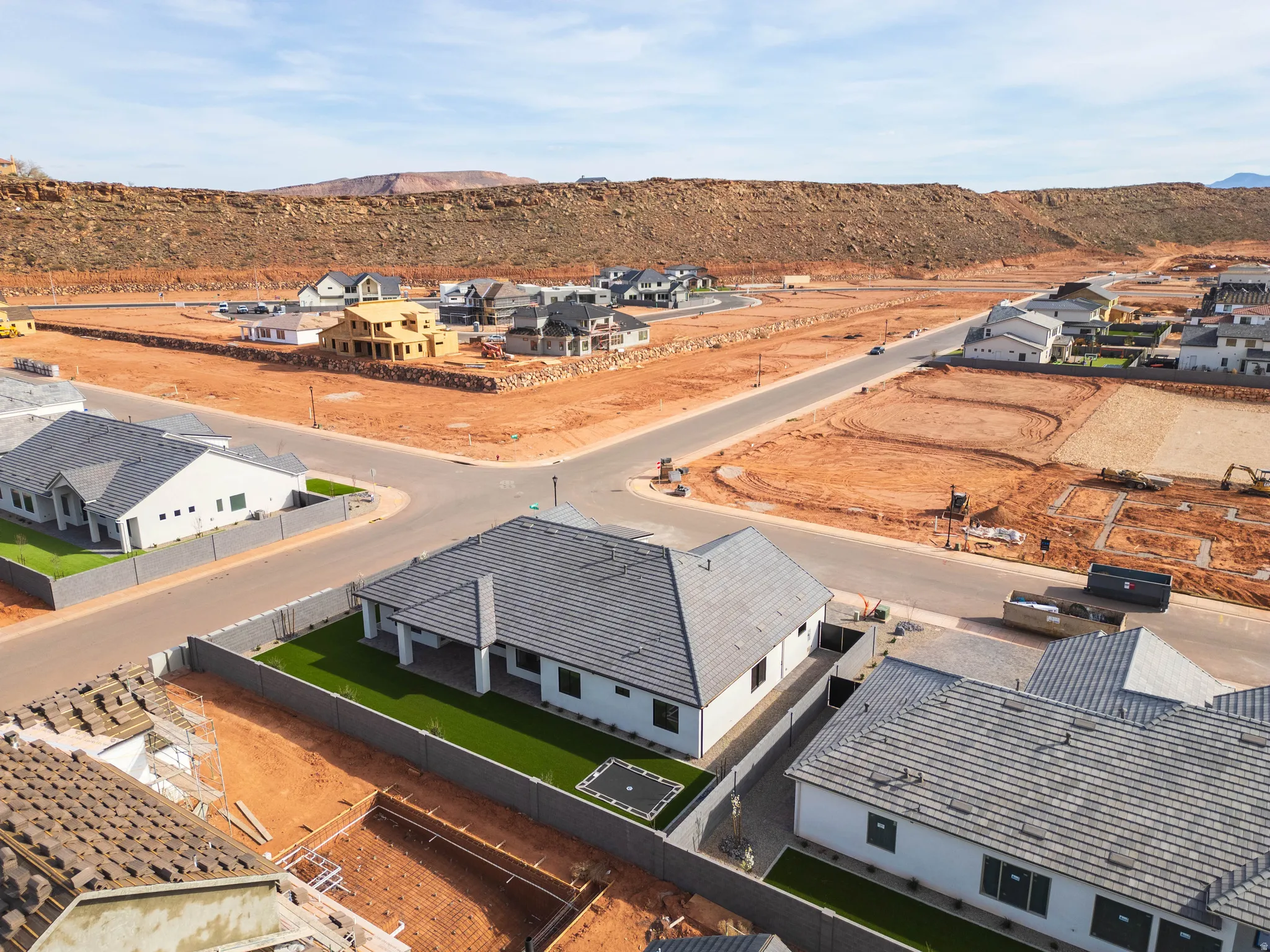 Aerial perspective of suburban area with a mountain backdrop