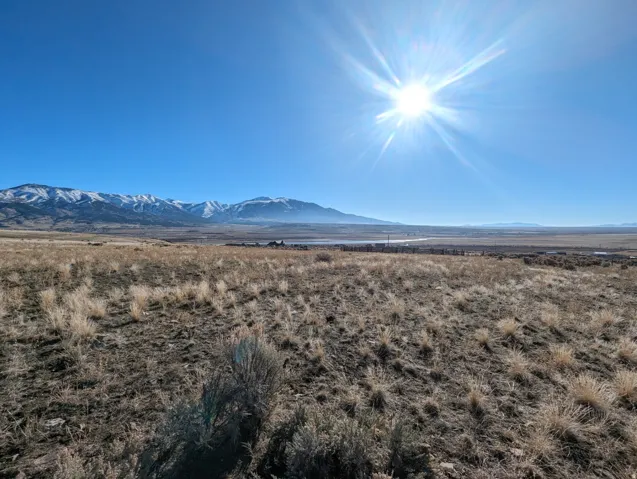 View of mountain backdrop with rural landscape