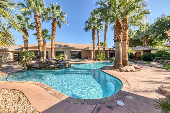 Swimming pool featuring an in-ground hot tub and a patio