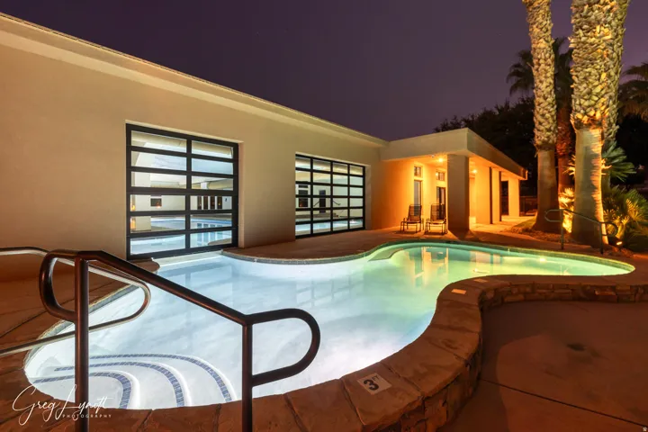 Pool at twilight featuring a patio and an outdoor pool
