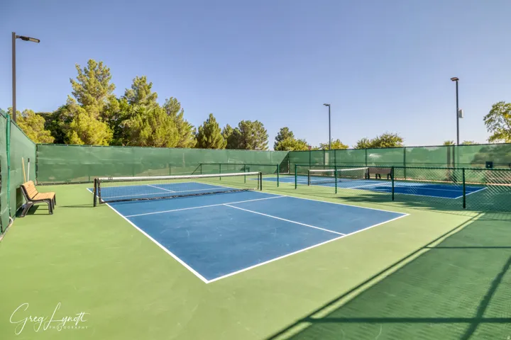 View of tennis court featuring community basketball court