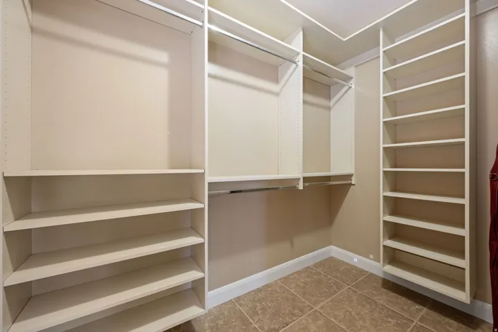Walk in closet featuring light tile patterned floors
