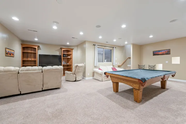 Recreation room featuring light colored carpet, recessed lighting, and billiards