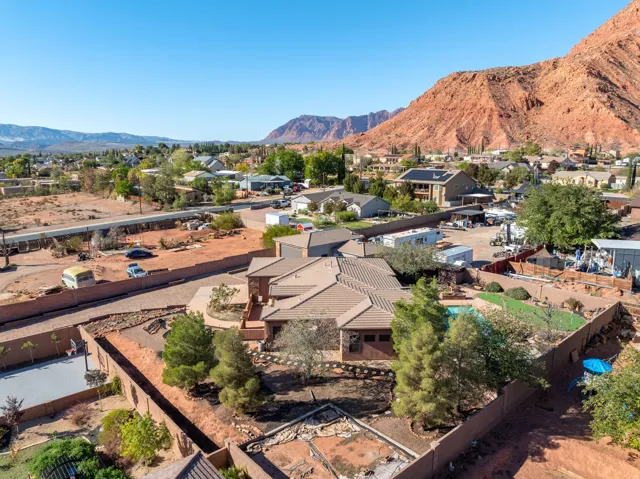 Aerial perspective of suburban area featuring a mountainous background
