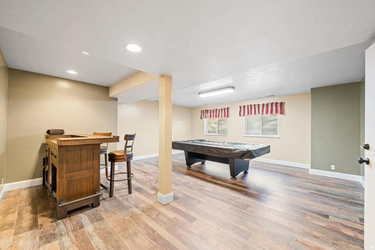 Playroom with billiards table, light wood-style flooring, and recessed lighting