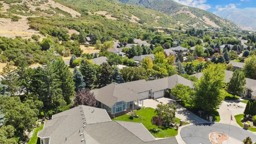 Aerial perspective of suburban area featuring a mountain backdrop