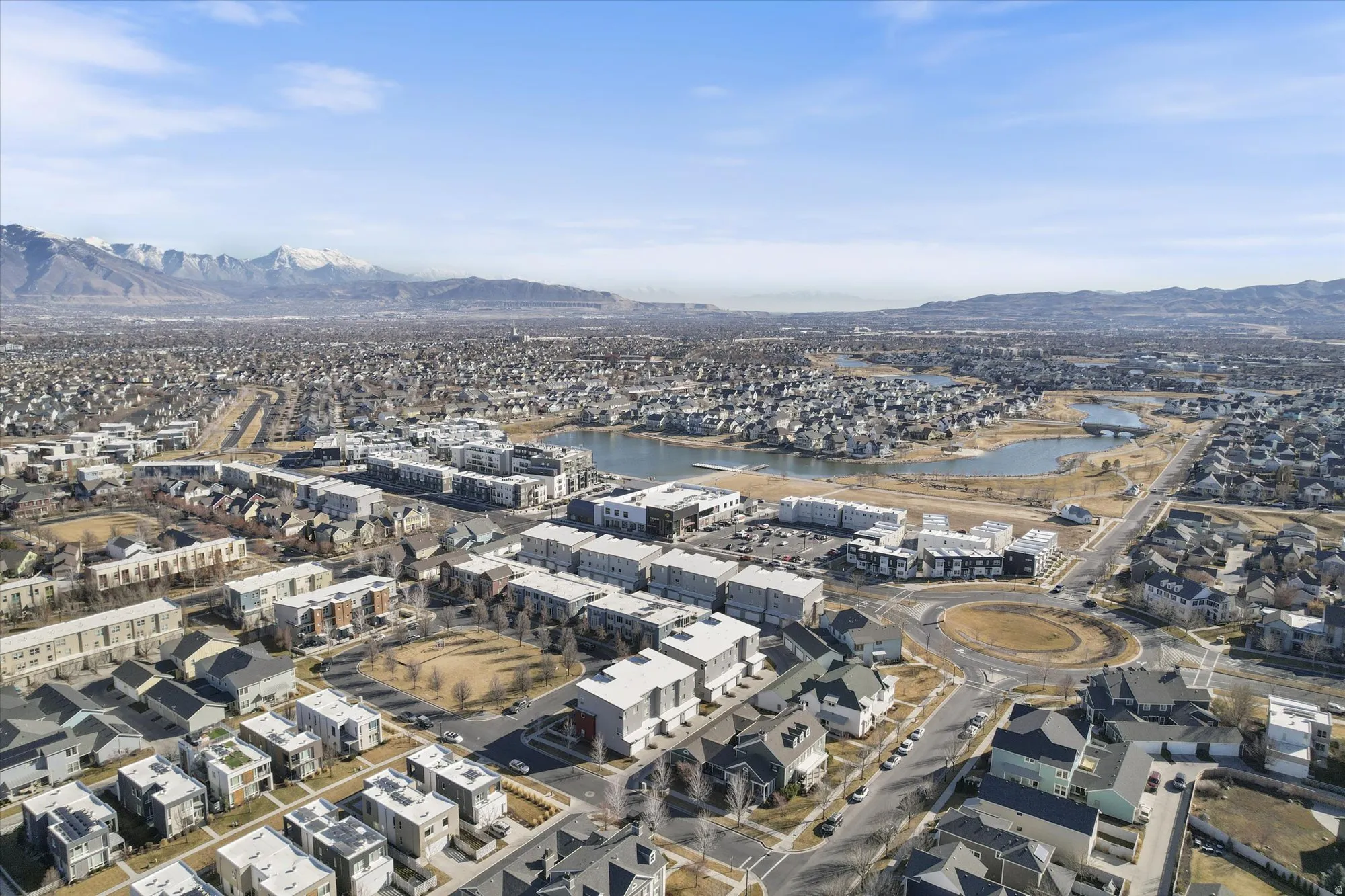 Aerial view of residential area featuring a water and mountain view