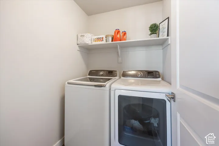 Laundry area featuring washing machine and clothes dryer