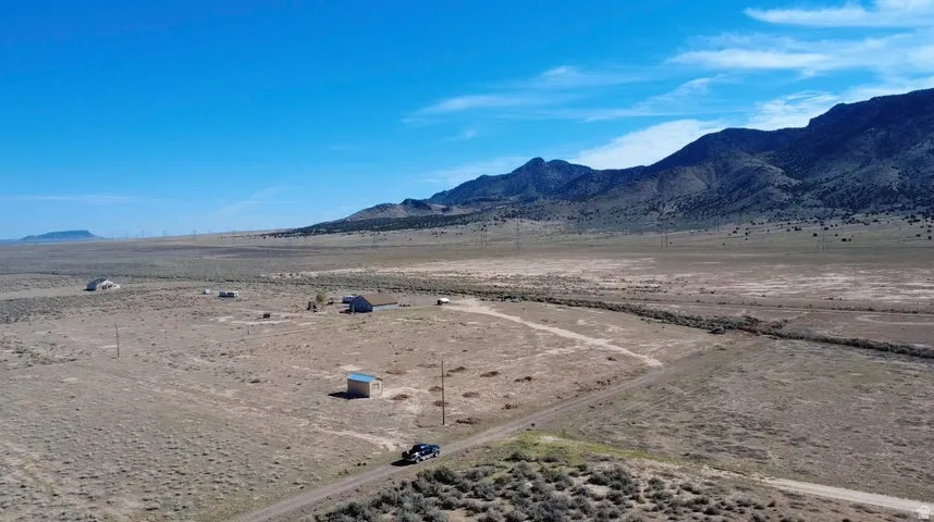 View of mountain backdrop featuring rural landscape and a desert landscape