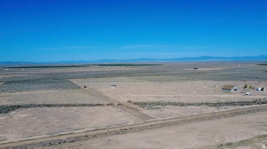 View of mountain backdrop featuring rural landscape and a desert landscape