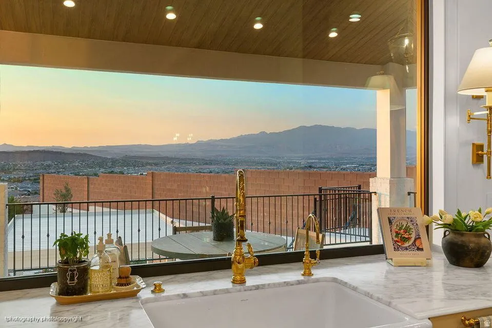 Balcony featuring a mountain view and a sink