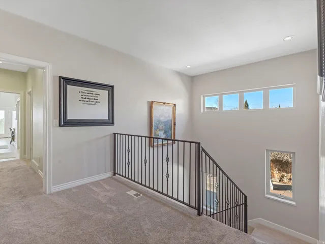 Stairway featuring carpet flooring and recessed lighting