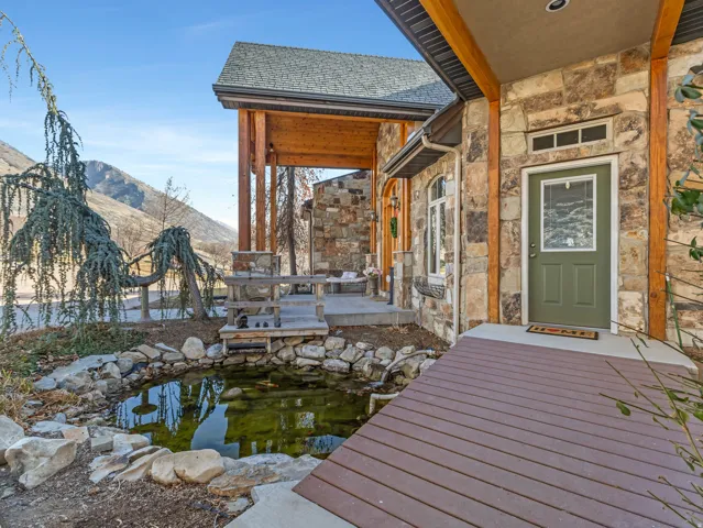Dock area featuring a garden pond and a mountain view