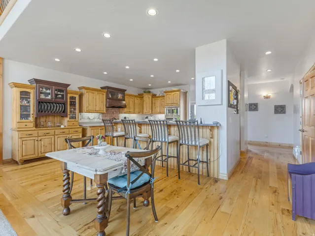 Dining area featuring light wood-type flooring and recessed lighting