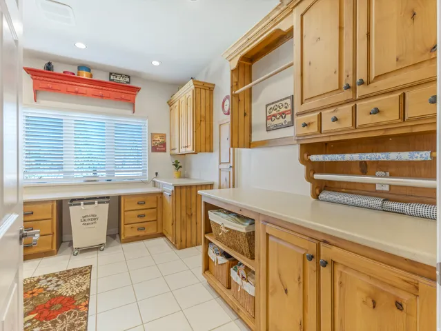 Kitchen featuring open shelves, light countertops, light tile patterned floors, recessed lighting, and light wood finish cabinets