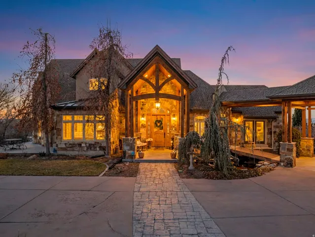 View of front of house featuring stone siding