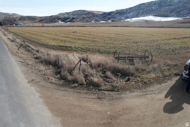 View of mountain backdrop with rural landscape