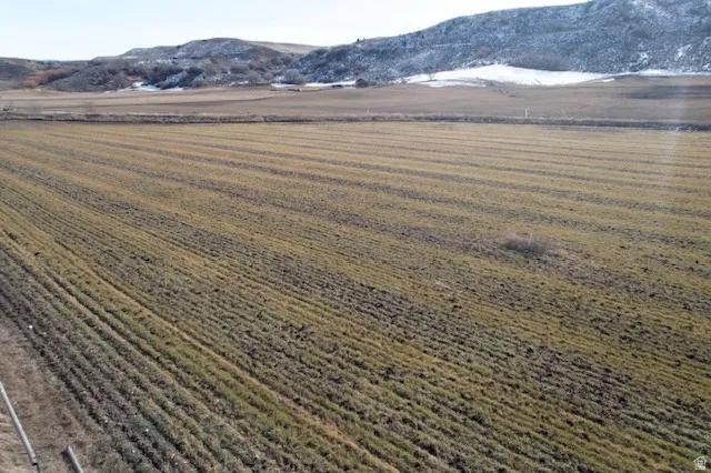 View of mountain backdrop with farmland and rural landscape