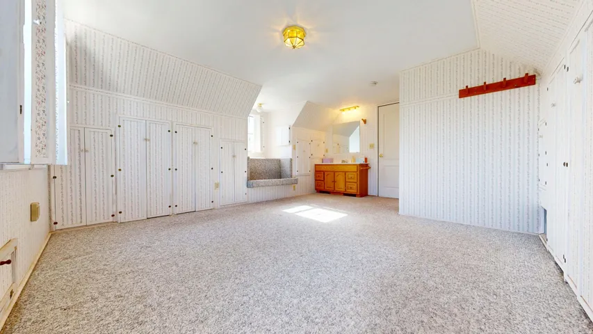 Second floor bedroom with plenty of storage and a private bath.