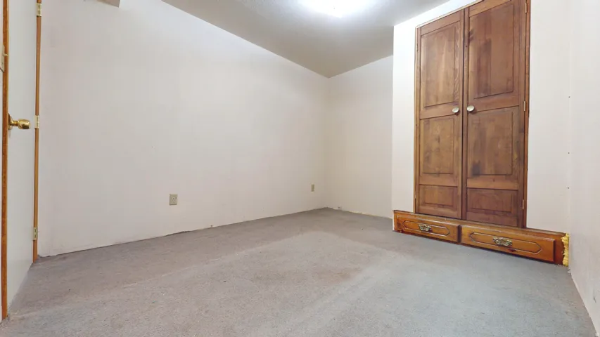 Non-conforming bedroom in basement apartment.
