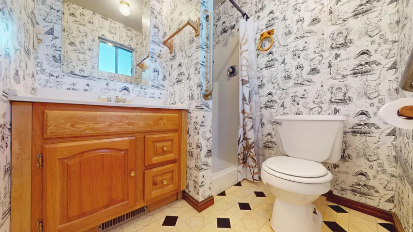 Bath attached to main bedroom on level 1.
