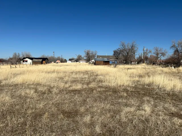 View of yard with a rural view
