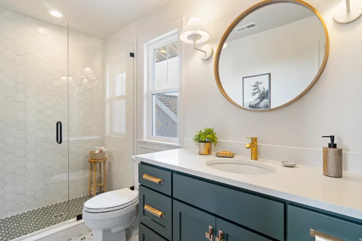 Full bath with vanity, a stall shower, and recessed lighting