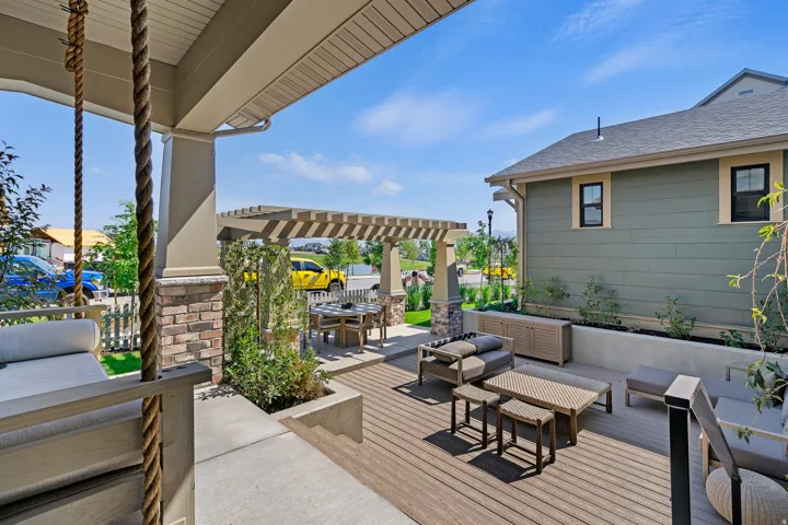 Deck featuring a pergola, an outdoor living / dining area, and a patio area