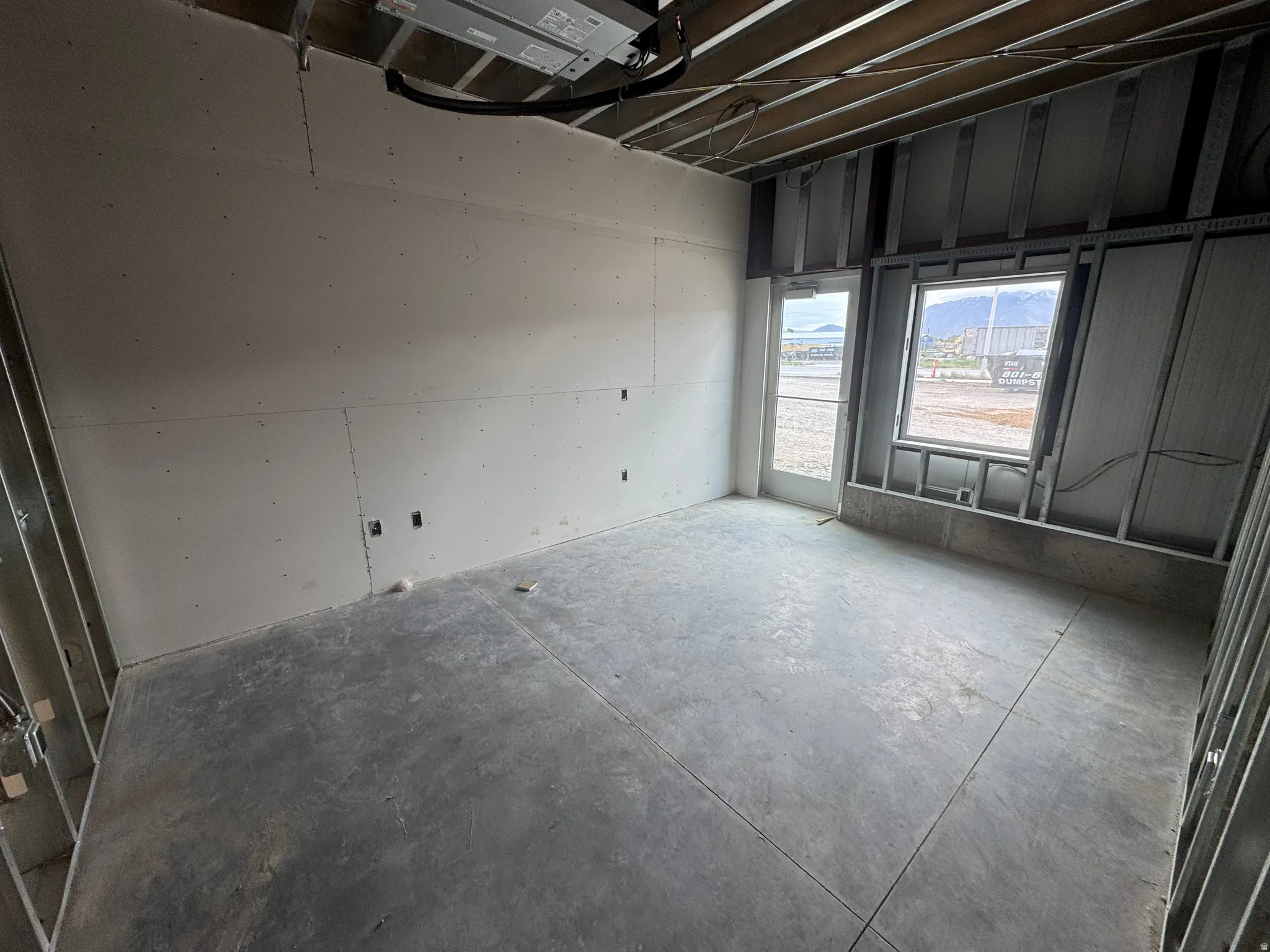 Spare room with concrete flooring