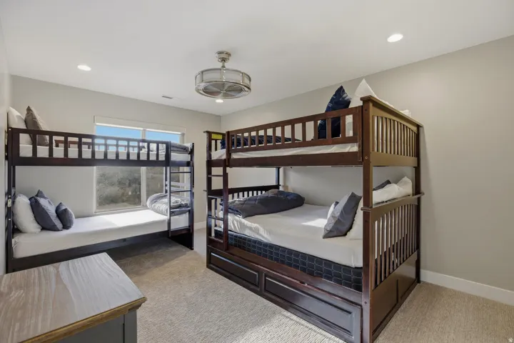 Bedroom featuring light colored carpet and recessed lighting