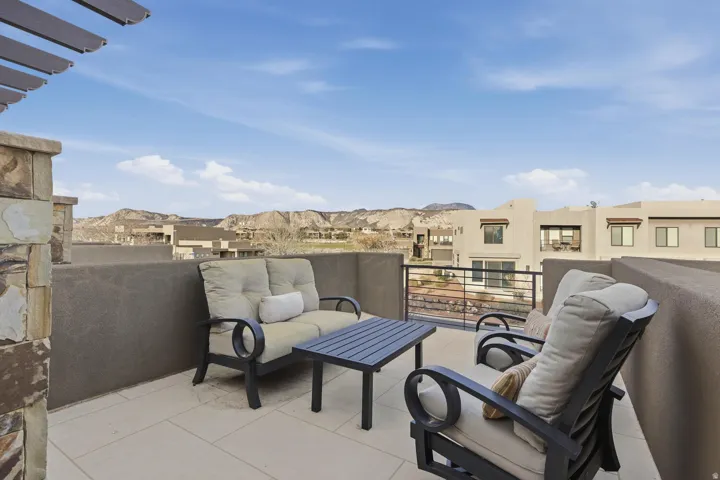 Balcony with a residential view and outdoor seating