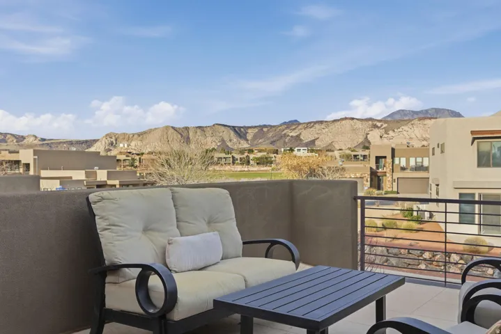 Balcony featuring a mountain view and a residential view