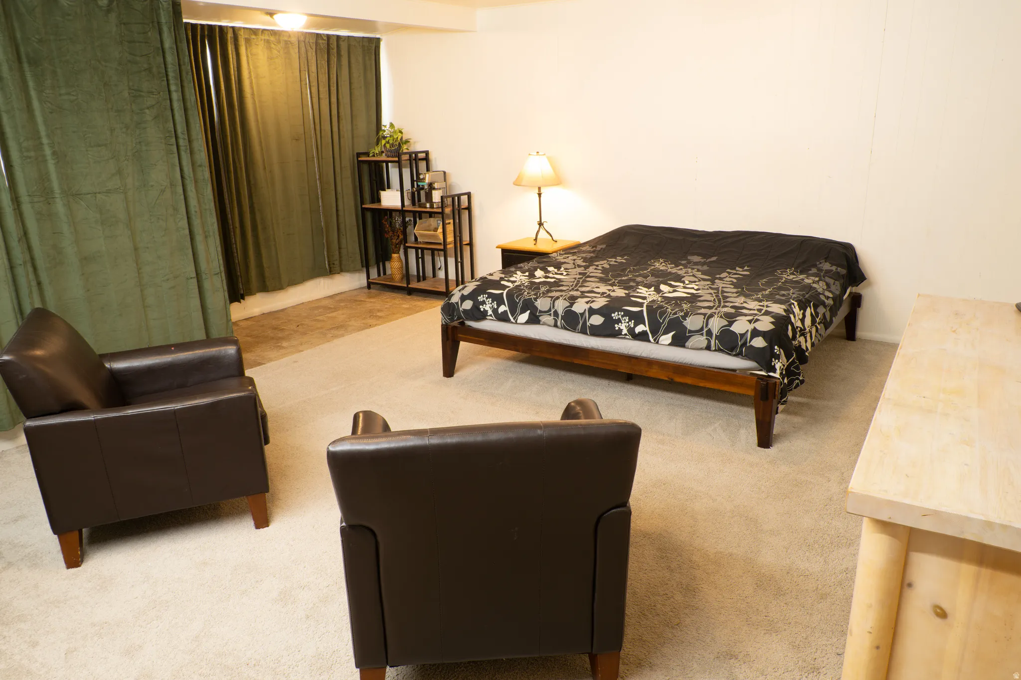Bedroom with light colored carpet
