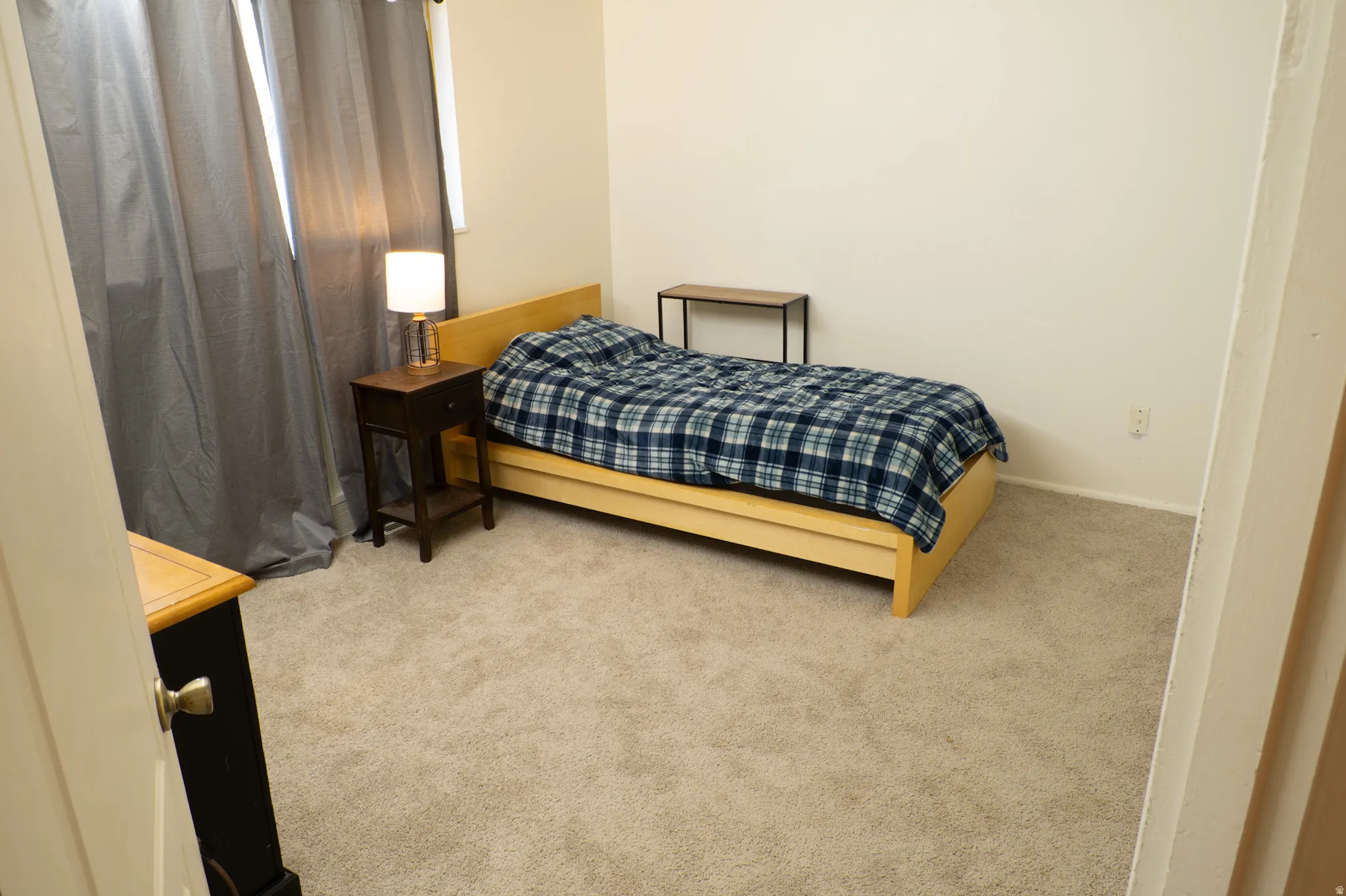 Bedroom with carpet flooring and baseboards