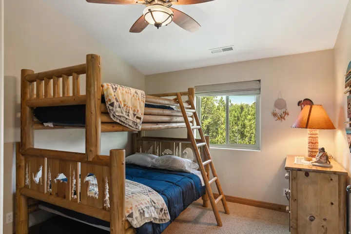 Bedroom with baseboards and ceiling fan