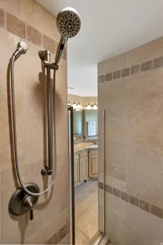 Full bath featuring vanity and a shower stall