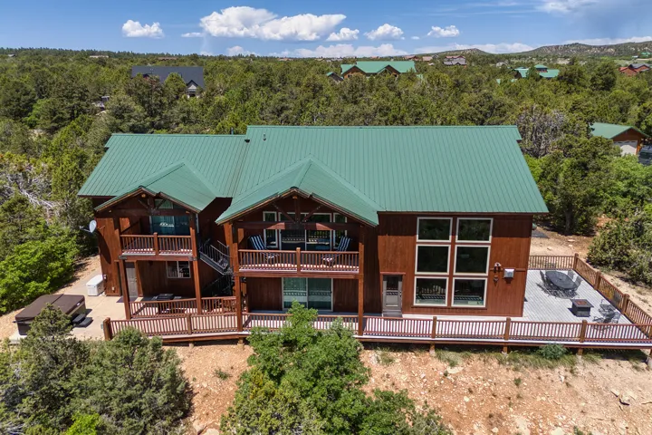Rear view of property with a wooden deck and a metal roof