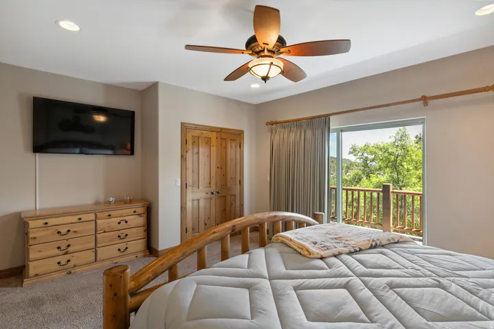 Carpeted bedroom featuring a closet, recessed lighting, access to exterior, and ceiling fan