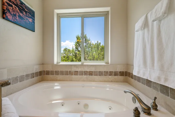 Bathroom with a tub with jets