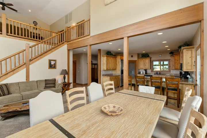 Dining space with recessed lighting, a ceiling fan, and a high ceiling