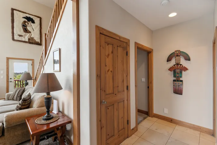 Entryway featuring baseboards and light tile patterned flooring