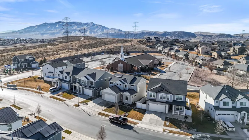 Aerial view of residential area featuring mountains