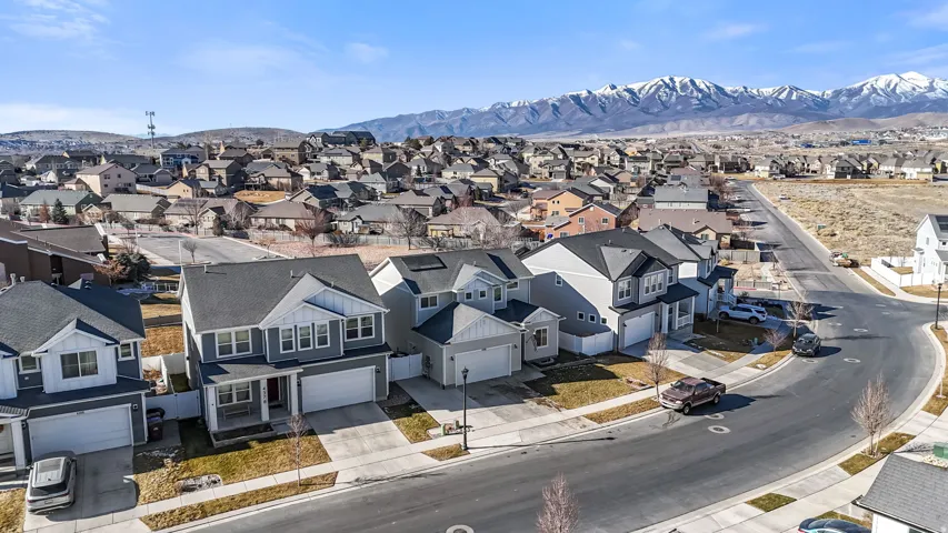 Aerial perspective of suburban area with a mountainous background
