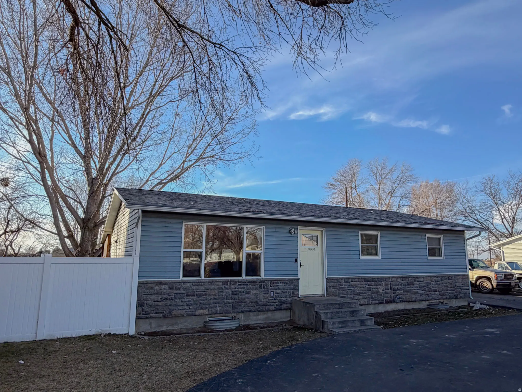 View of front of house with stone siding