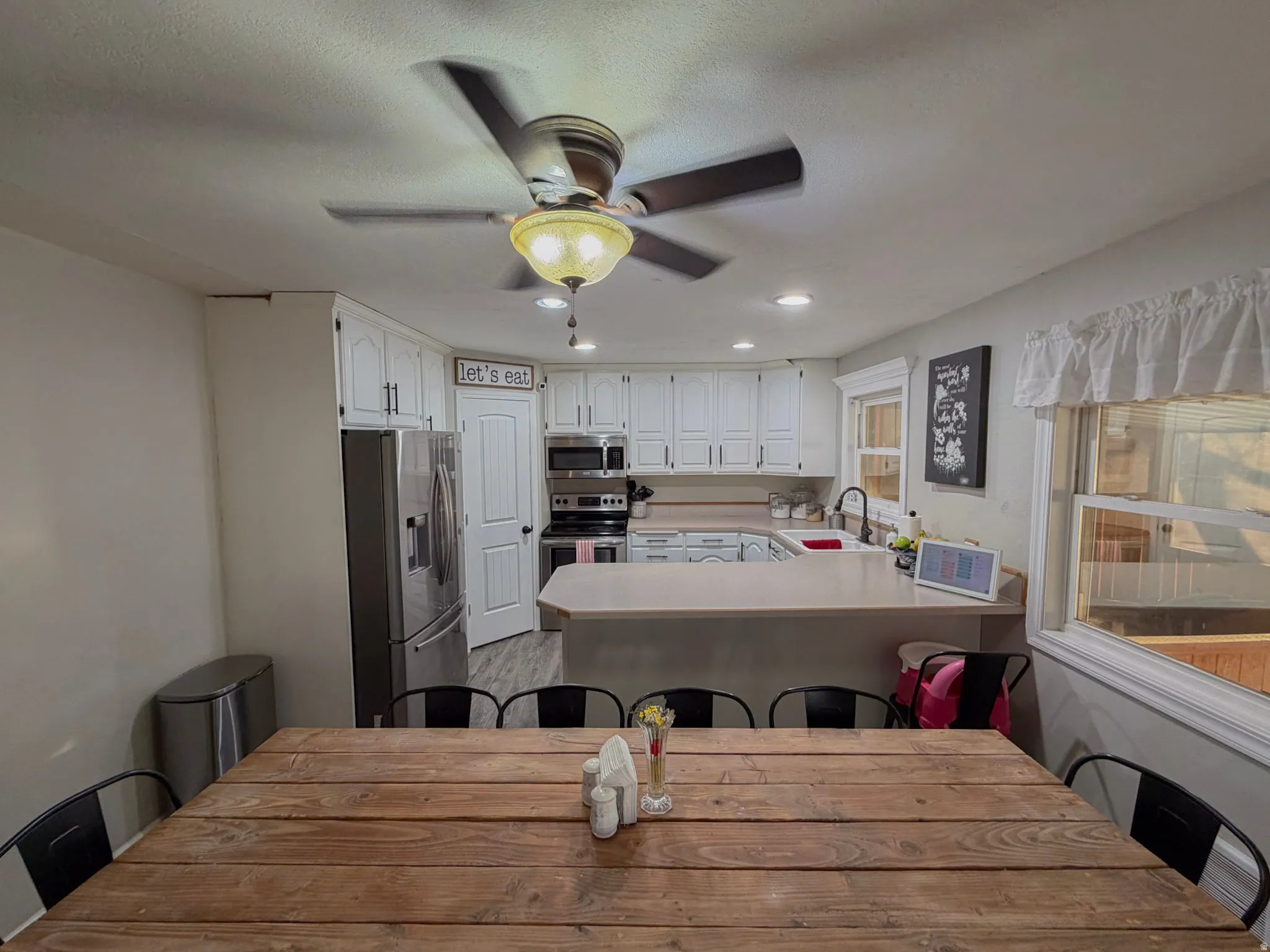Dining area featuring recessed lighting and a ceiling fan