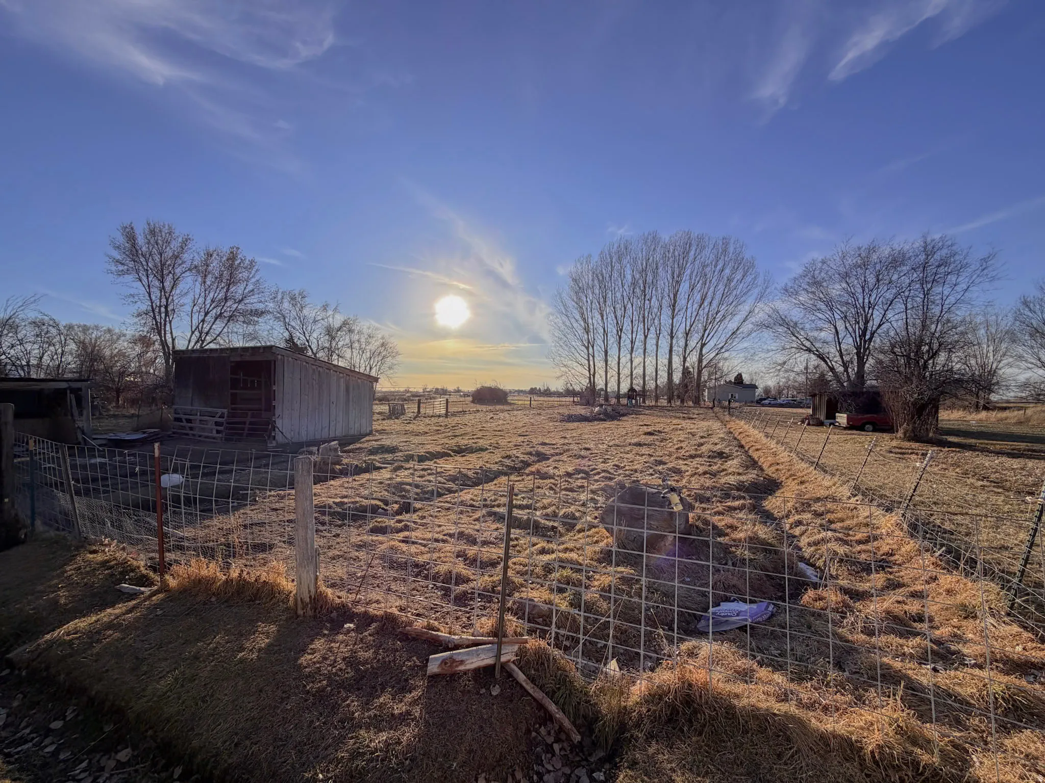 View of yard with a rural view and an outbuilding