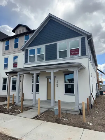 View of front of house featuring a porch and stucco siding
