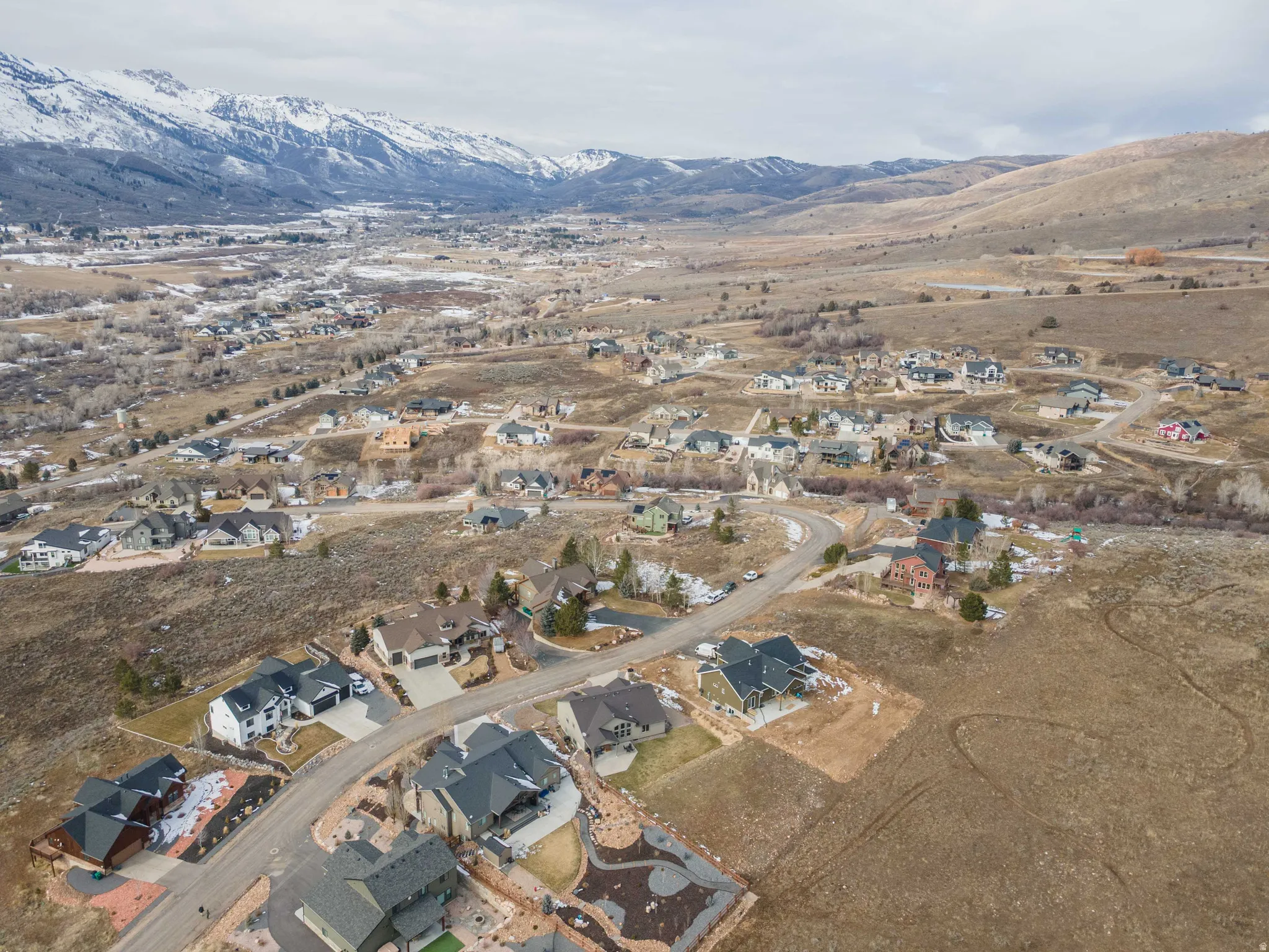 View of property location with nearby suburban area and mountains