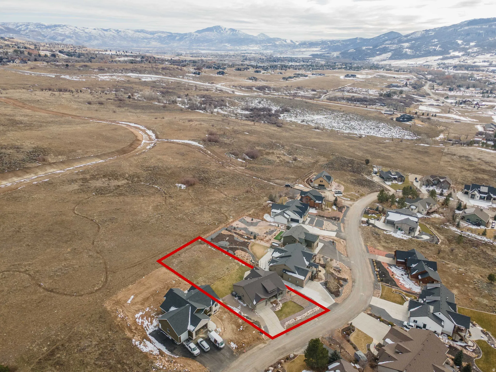 View of property location featuring property boundaries highlighted, nearby suburban area, and rural landscape