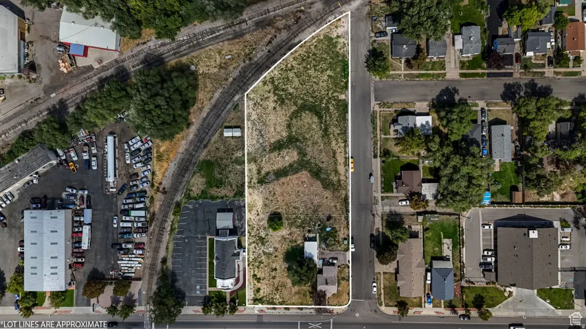 Aerial view of residential area with property parcel outlined